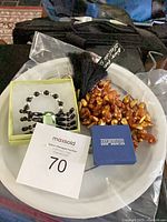 Group shot showing bracelet, shell necklace with tassel, and Silveritaly box