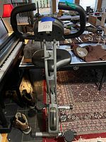 Front view of Exerpeutic folding magnetic upright bike showing handlebars, seat and pedals