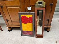 Painting and mirror standing together for scale and overview