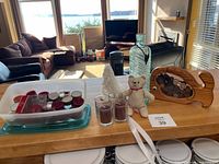 Full lot showing whale bank, vase, tree sculpture, knit bear, candles in tub and votive holders