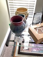 Three vases grouped on glass table
