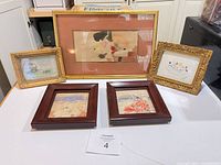 Group view of all 5 framed artworks