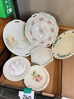 Group shot of all six plates and trays
