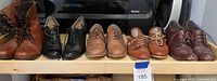 Six pairs shoes on shelf showing overall lot