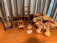 Group shot of five mini chairs, plush bunny, pink tote