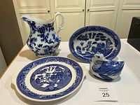 Front view showing all four blue & white ceramic pieces