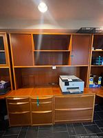 Full view of teak wall unit showing hutch, desktop, and filing cabinets