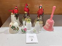 All seven bells grouped, cardinal figurine bells at back, four hand bells at front