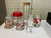 All six glass storage pieces grouped together