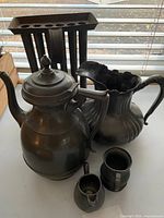 Group view showing teapot/coffee pot, pitcher, creamer and one mug/tankard
