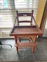 Front view showing high chair with tray attached