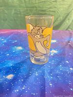 Front view of glass showing Tom graphic and clear condition