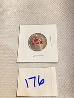 Front view of 2009 Canadian coloured quarter in holder