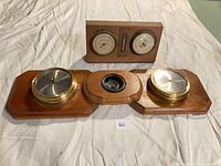 Both weather stations side by side showing overall design and missing thermometer