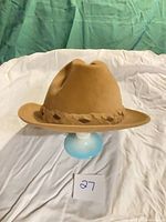 Tan Biltmore velour fedora on stand, front view