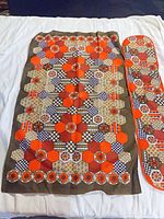 Tea towel and oven mitt laid flat showing full pattern