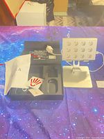 Kala Mini panel on stand with box and accessories on table