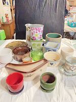 Group shot of all planters and drip plate on cloth