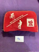 Front of red Bike N Hike first aid kit with logo and text
