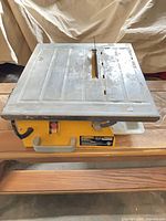 Top view of WorkForce THD550 tile saw showing cutting table, blade, switch