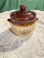 Front view of stoneware bean crock with lid