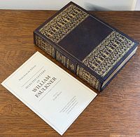 Book and pamphlet together showing cover design and overall condition