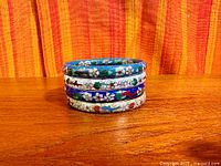 Four cloisonné bangles stacked side view
