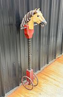 Full view of hobby horse standing upright