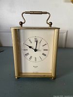 Front view showing full clock, dial and missing foot area