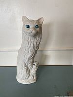Front view of matte white ceramic cat and kitten figurine