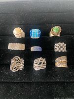 All nine rings displayed in velvet tray