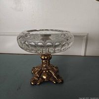 Full view of ashtray showing glass bowl and ornate metal pedestal