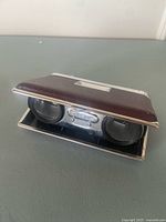 Pal-F folding opera glasses half opened