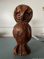 Front view of carved wooden owl figurine
