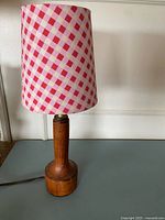 Full view of lamp showing shade and teak base
