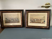 Both framed prints side by side showing overall size and matching frames