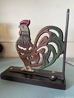 Full view of rooster bookend standing on base