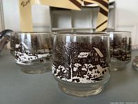 Front view of three glasses showing winter landscape design