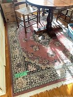 Large rug under dining table showing overall pattern and color