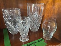 Group shot of four vases on shelf