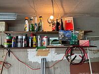 overall view of shelves with cleaners, aerosols, motor oil, lightbulbs, brake pads