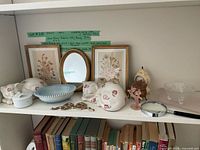 Entire shelf with multiple vintage decor items
