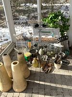 Overall lot with four beige planters in foreground