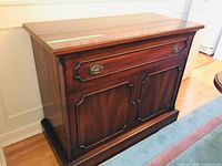 Front view of Gibbard buffet server showing drawer, doors, hardware, and wood finish