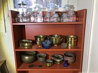 shelf with glass jars and metal planters