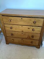 Front view four-drawer pine dresser, wooden knobs
