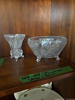 Bud vase and bowl on shelf