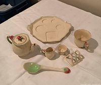 Full view of all seven pieces arranged on table