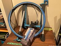 Trainer stand, wheel with blue tyre, boxed trainer tyre