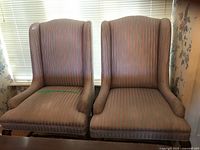 Front view of both upholstered chairs showing overall design and fabric pattern